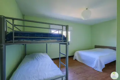 Un ou plusieurs lits dans un hébergement de l'établissement Sanguinet Appartement 3 chambres proche du lac