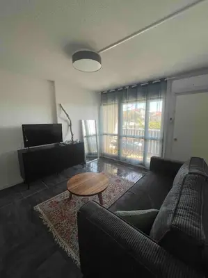Coin salon dans l'établissement Appartement rénové au Penon