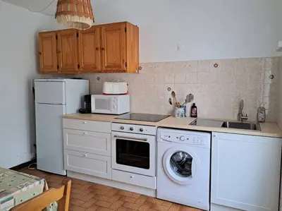 Cuisine ou kitchenette dans l'établissement Cigale
