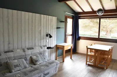 Coin salon dans l'établissement Le Village Vacances de Mimizan Plage