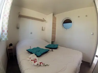 Un ou plusieurs lits dans un hébergement de l'établissement Le Village Vacances de Mimizan Plage