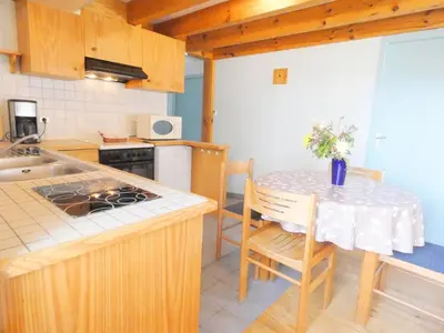 Cuisine ou kitchenette dans l'établissement Gite bleu