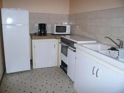 Cuisine ou kitchenette dans l'établissement Le moulin
