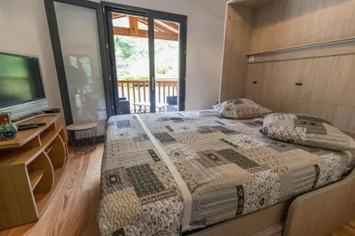 Un ou plusieurs lits dans un hébergement de l'établissement La maison de grand-pere, appt cote lac