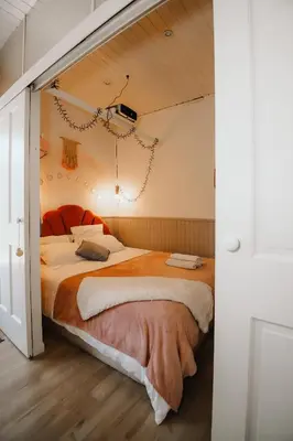 Un ou plusieurs lits dans un hébergement de l'établissement Coquillages et crustacés, Netflix baignoire îlot chez Ivona Vacances