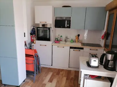 Cuisine ou kitchenette dans l'établissement Océane