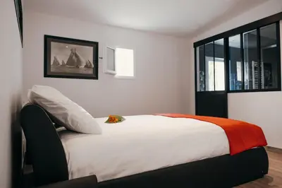 Un ou plusieurs lits dans un hébergement de l'établissement LA MAISON CACHEE-BA