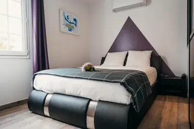 Un ou plusieurs lits dans un hébergement de l'établissement LA MAISON CACHEE-BA