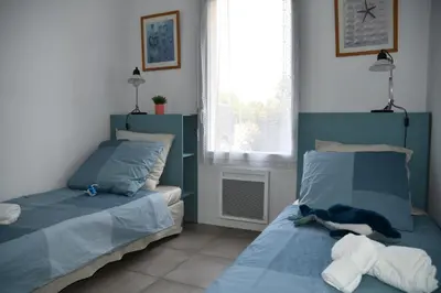 Un ou plusieurs lits dans un hébergement de l'établissement Appartement T3 (plain-pied) et son jardin privatif clos à Vieux Boucau