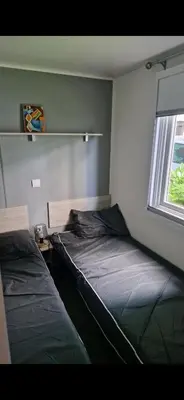 Un ou plusieurs lits dans un hébergement de l'établissement Mobil Home Camping 4*