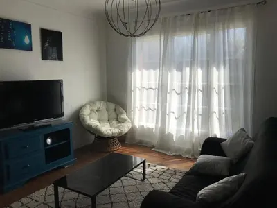 Télévision ou salle de divertissement dans l'établissement Appartement spacieux et lumineux