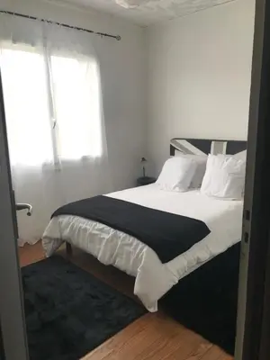 Un ou plusieurs lits dans un hébergement de l'établissement Appartement spacieux et lumineux