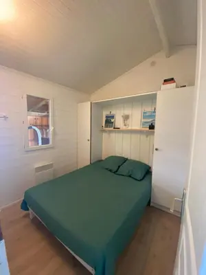 Un ou plusieurs lits dans un hébergement de l'établissement Le chalet Arcachonais