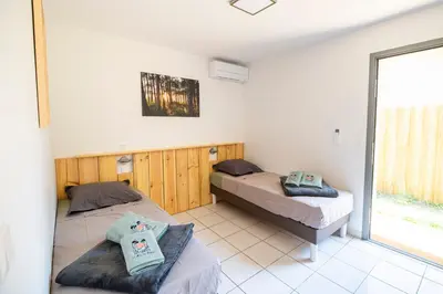 Un ou plusieurs lits dans un hébergement de l'établissement un Air de Repos