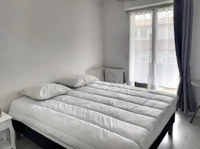 Un ou plusieurs lits dans un hébergement de l'établissement Appartement La Teste-de-Buch