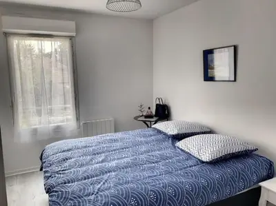 Un ou plusieurs lits dans un hébergement de l'établissement Appartement La Teste-de-Buch
