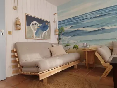 Coin salon dans l'établissement Petite Villa La Pantoufle au Domaine du Golf de Pinsolle