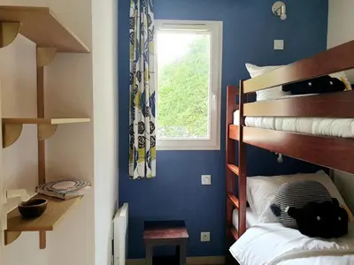 Un ou plusieurs lits dans un hébergement de l'établissement Petite Villa La Pantoufle au Domaine du Golf de Pinsolle