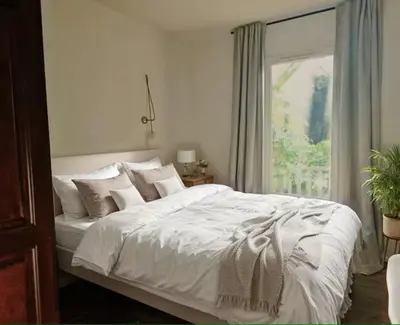 Un ou plusieurs lits dans un hébergement de l'établissement Petite Villa La Pantoufle au Domaine du Golf de Pinsolle