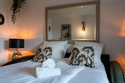 Un ou plusieurs lits dans un hébergement de l'établissement Studio plage de Capbreton avec terrasse