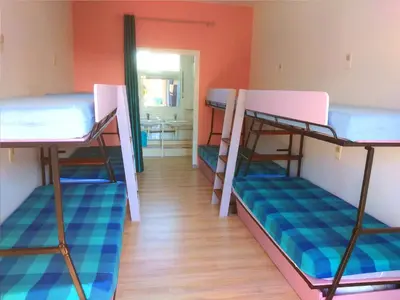 Un ou plusieurs lits dans un hébergement de l'établissement Gites et Chambres La colo du gave