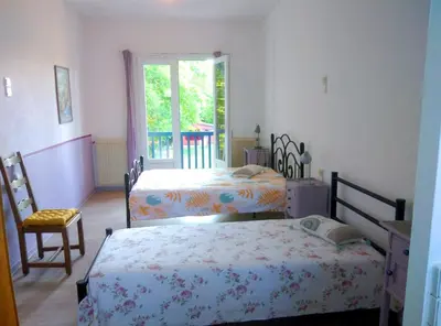 Un ou plusieurs lits dans un hébergement de l'établissement Gites et Chambres La colo du gave