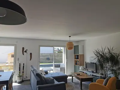 Coin salon dans l'établissement Villa en lisière de forêt