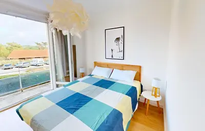 Un ou plusieurs lits dans un hébergement de l'établissement Sable - Appartement rénové pour 4 personnes