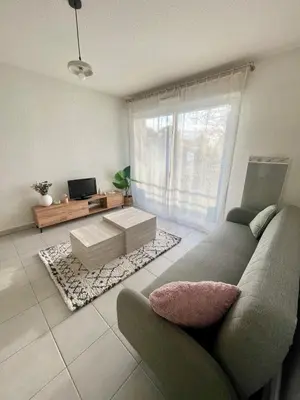 Coin salon dans l'établissement Appartement cosy avec balcon