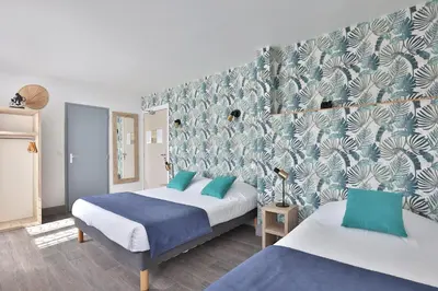 Un ou plusieurs lits dans un hébergement de l'établissement Hotel du Cap