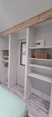 Un ou plusieurs lits dans un hébergement de l'établissement Chalet avec Jacuzzi