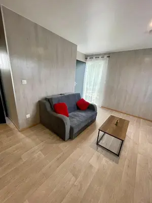 Coin salon dans l'établissement Appartement - location saisonnière