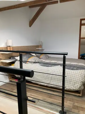 Un ou plusieurs lits dans un hébergement de l'établissement Appartement cosy avec grande terrasse