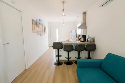 Coin salon dans l'établissement Jolie maison au calme proche du lac