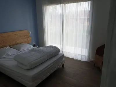 Un ou plusieurs lits dans un hébergement de l'établissement Maison récent proche du lac de Léon et de l'Océan
