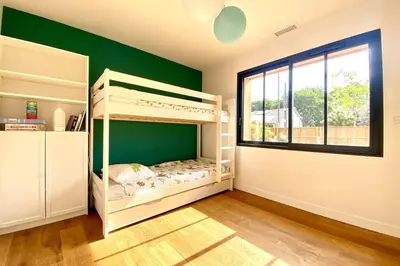 Un ou plusieurs lits dans un hébergement de l'établissement Villa neuve climatisée avec piscine chauffée