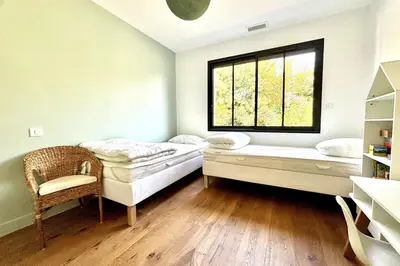 Un ou plusieurs lits dans un hébergement de l'établissement Villa neuve climatisée avec piscine chauffée