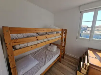 Un ou plusieurs lits dans un hébergement de l'établissement Super emplacement duplex climatisé