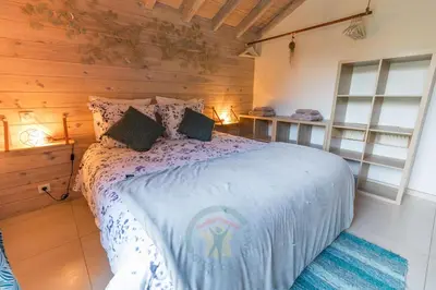 Un ou plusieurs lits dans un hébergement de l'établissement Gite et Spa La Bougerie