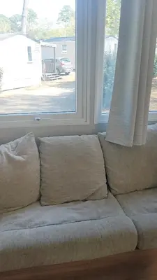 Coin salon dans l'établissement Mobil home tout confort