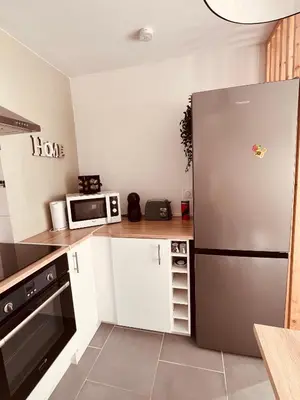 Cuisine ou kitchenette dans l'établissement Le Doux Refuge