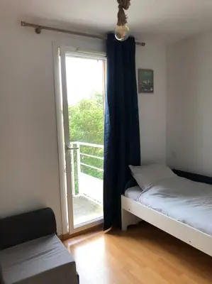 Un ou plusieurs lits dans un hébergement de l'établissement A deux pas du port, jolie maison redécorée