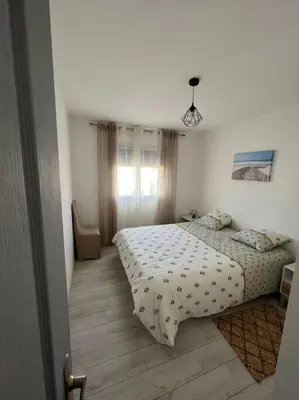 Un ou plusieurs lits dans un hébergement de l'établissement Appartement à 15 min des plages