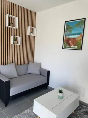 Coin salon dans l'établissement Appartement à 15 min des plages