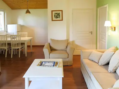Coin salon dans l'établissement Holiday Home Les Cottages du Lac M3 Privilège by Interhome
