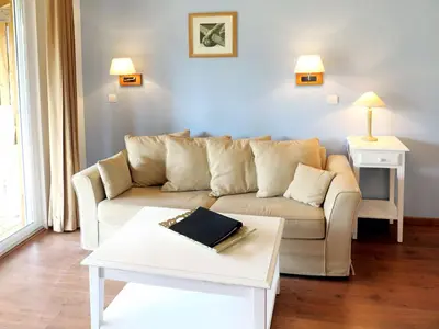 Coin salon dans l'établissement Apartment Les Cottages du Lac T3 Privilège by Interhome