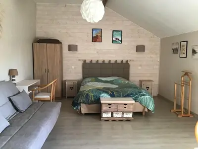 Un ou plusieurs lits dans un hébergement de l'établissement Chambre d'hôtes Maison des 5 Fleurs