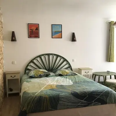 Un ou plusieurs lits dans un hébergement de l'établissement Chambre d'hôtes Maison des 5 Fleurs