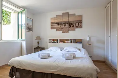 Un ou plusieurs lits dans un hébergement de l'établissement Le Petit Moulleau - Appt dans villa classée à 50m de la plage