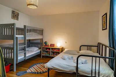 Un ou plusieurs lits dans un hébergement de l'établissement Le Petit Moulleau - Appt dans villa classée à 50m de la plage